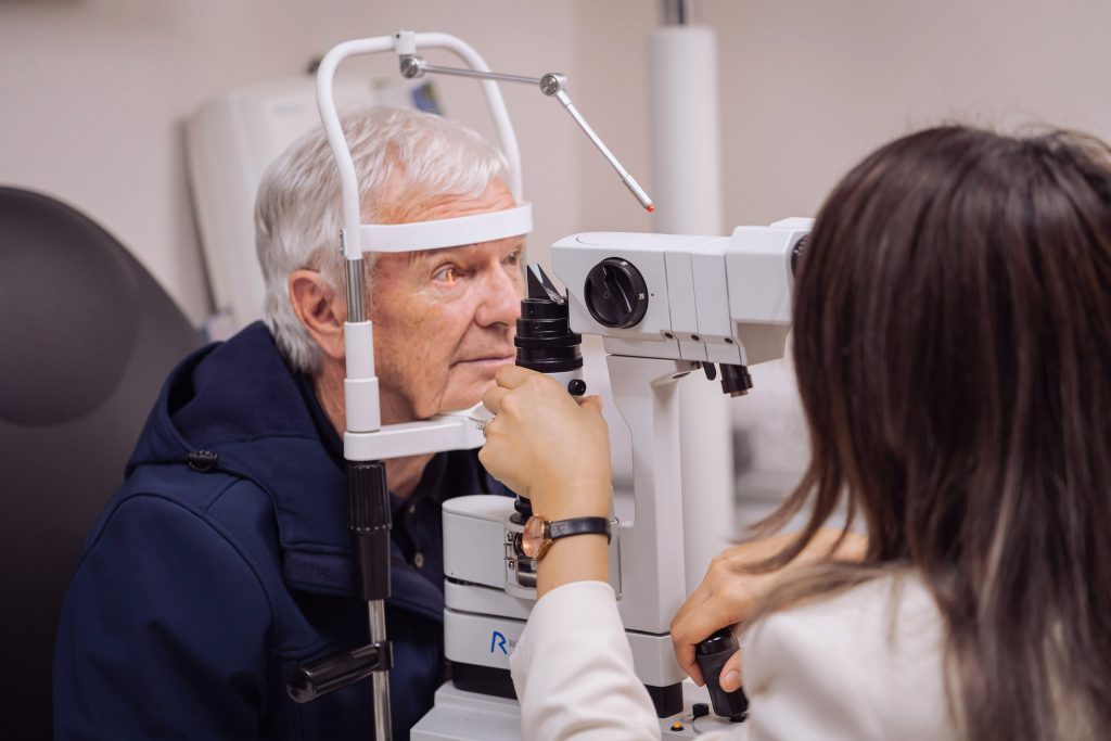Abra & Co optometrist conducting home eye test for elderly parent in Greater Manchester