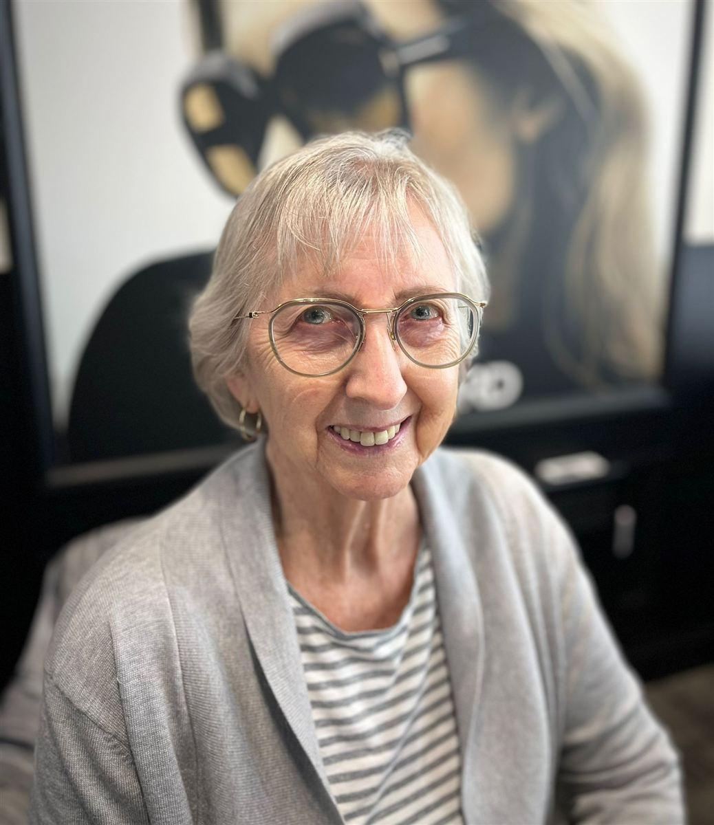 One of our patients in their new glasses, chosen at Abra & Co