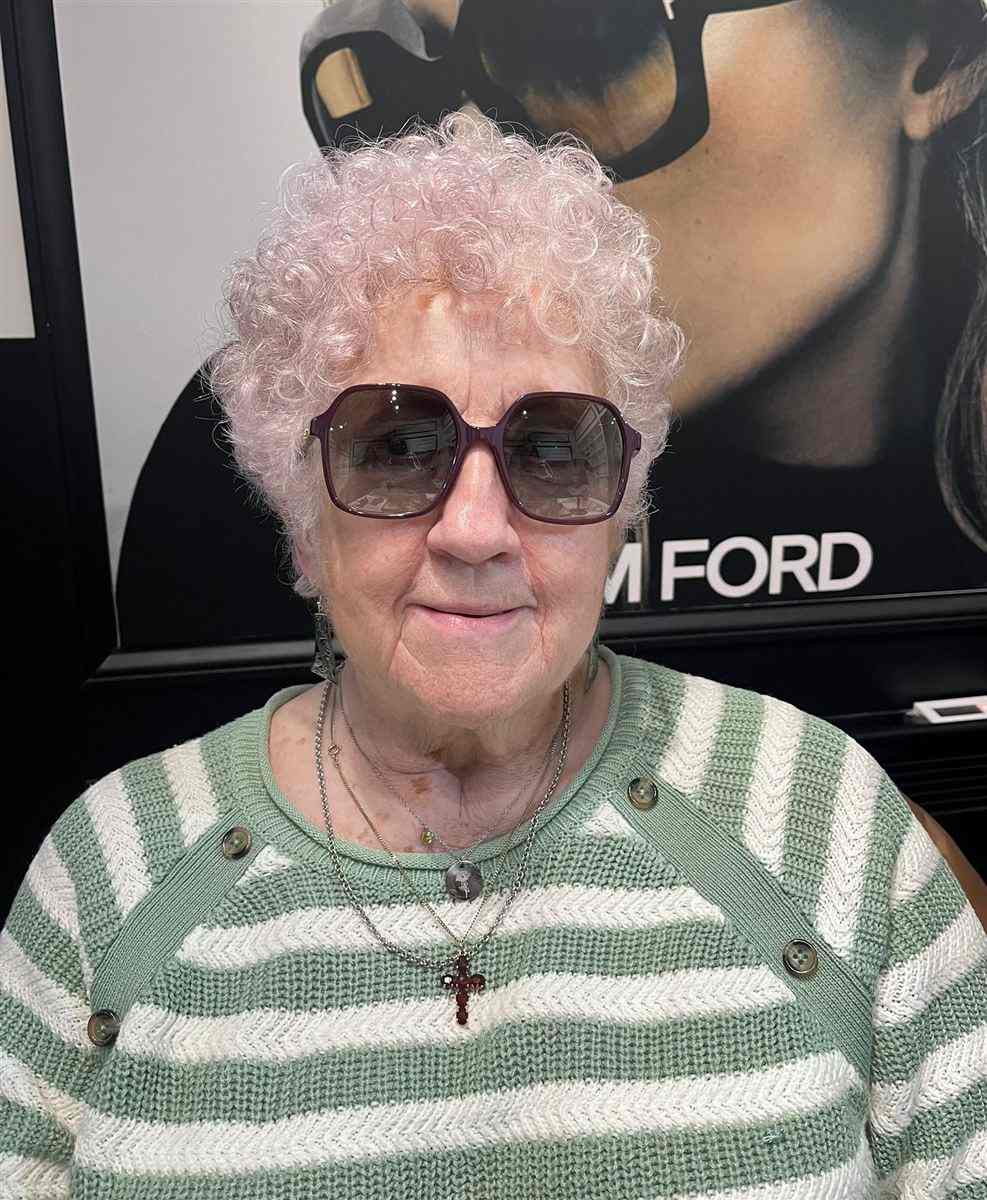 One of our patients in their new glasses, chosen at Abra & Co