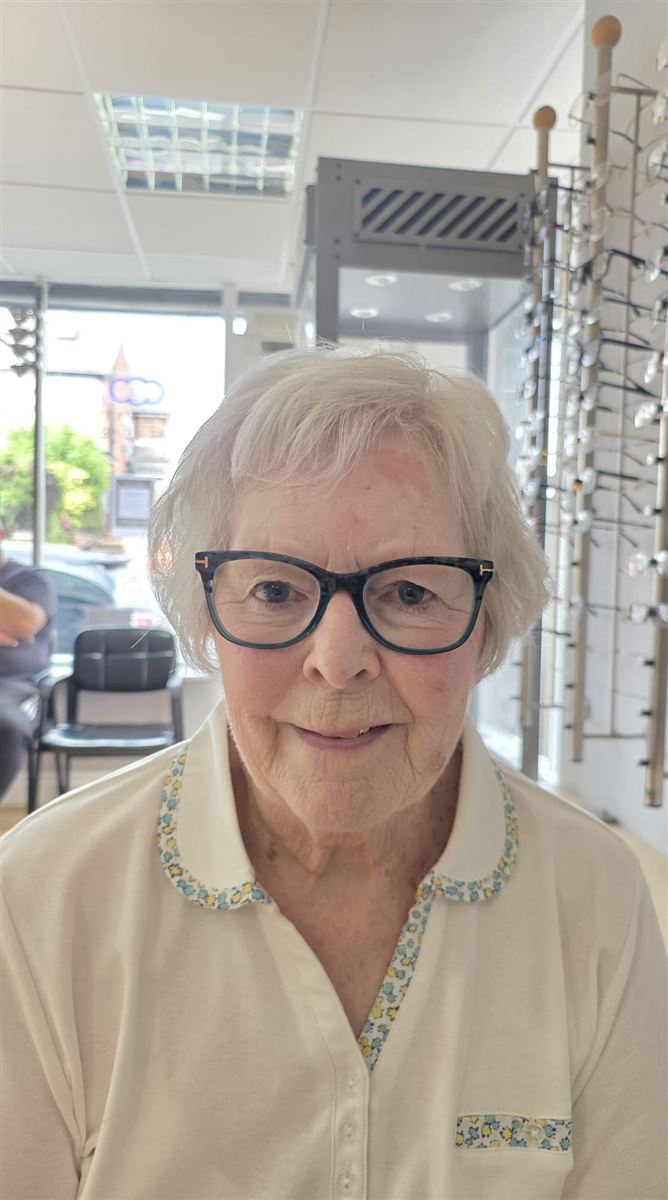 One of our patients in their new glasses, chosen at Abra & Co