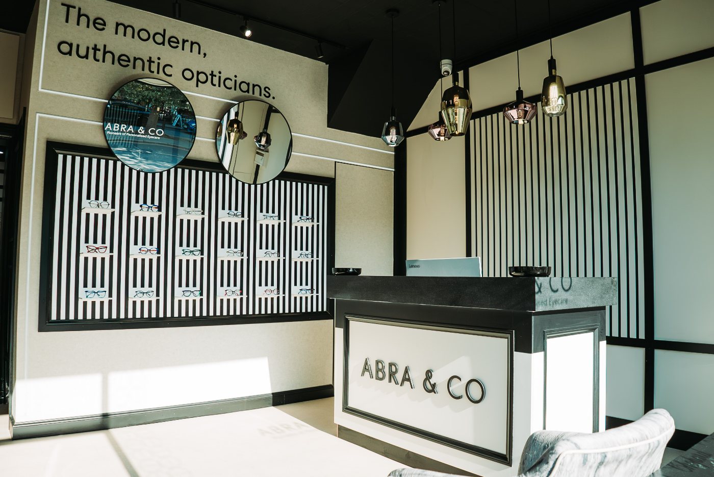 Striped walls and the front desk inside our boutique