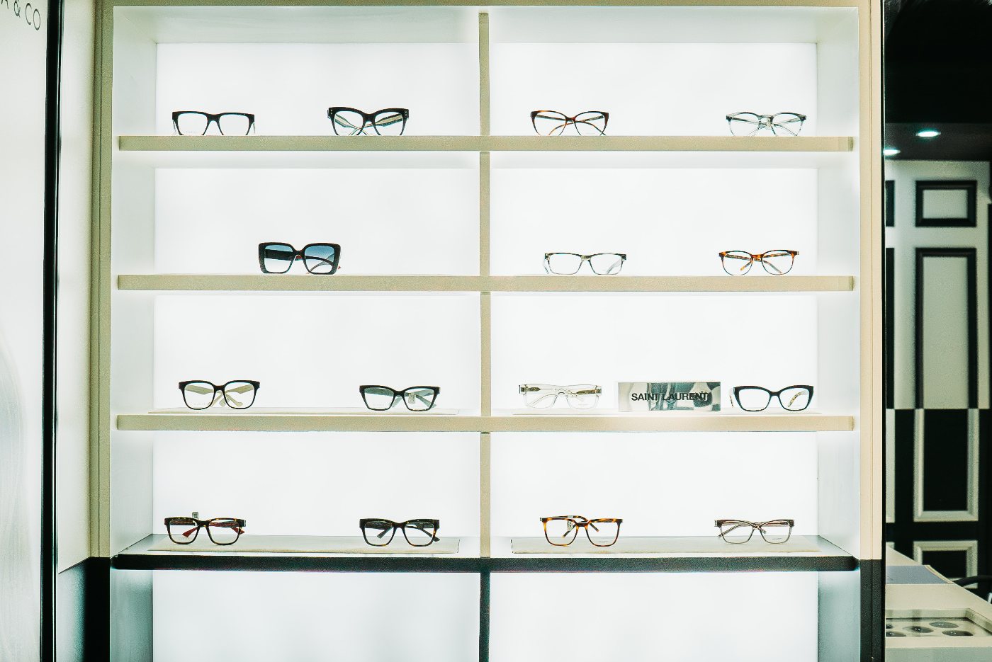 A wall of backlit frame shelves