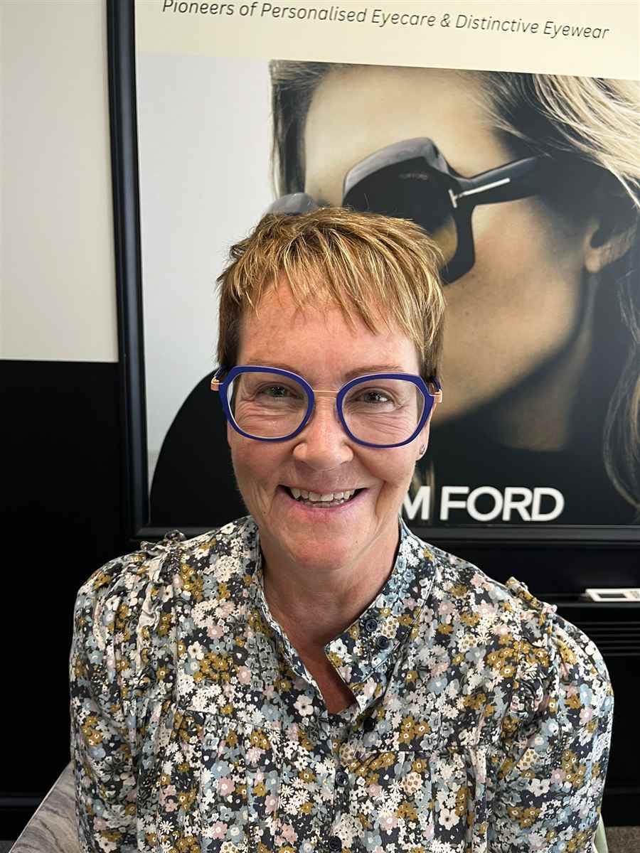 A patient with short hair in blue glasses, chosen at Abra & Co