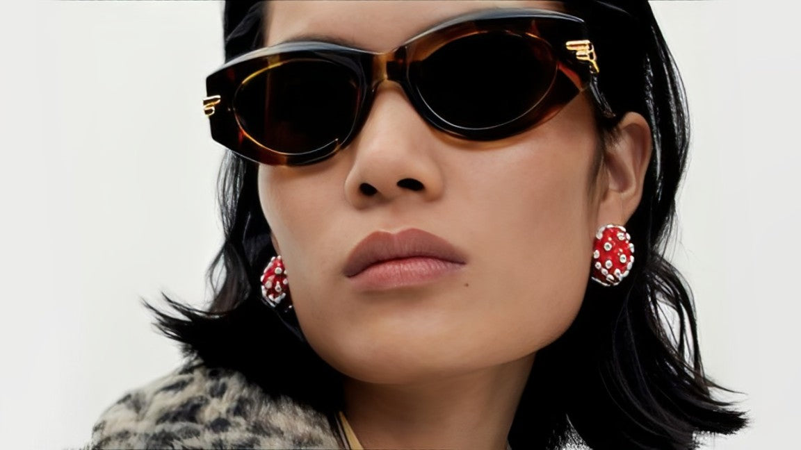 Model in tortoiseshell Bottega Veneta BV1322S cat-eye sunglasses